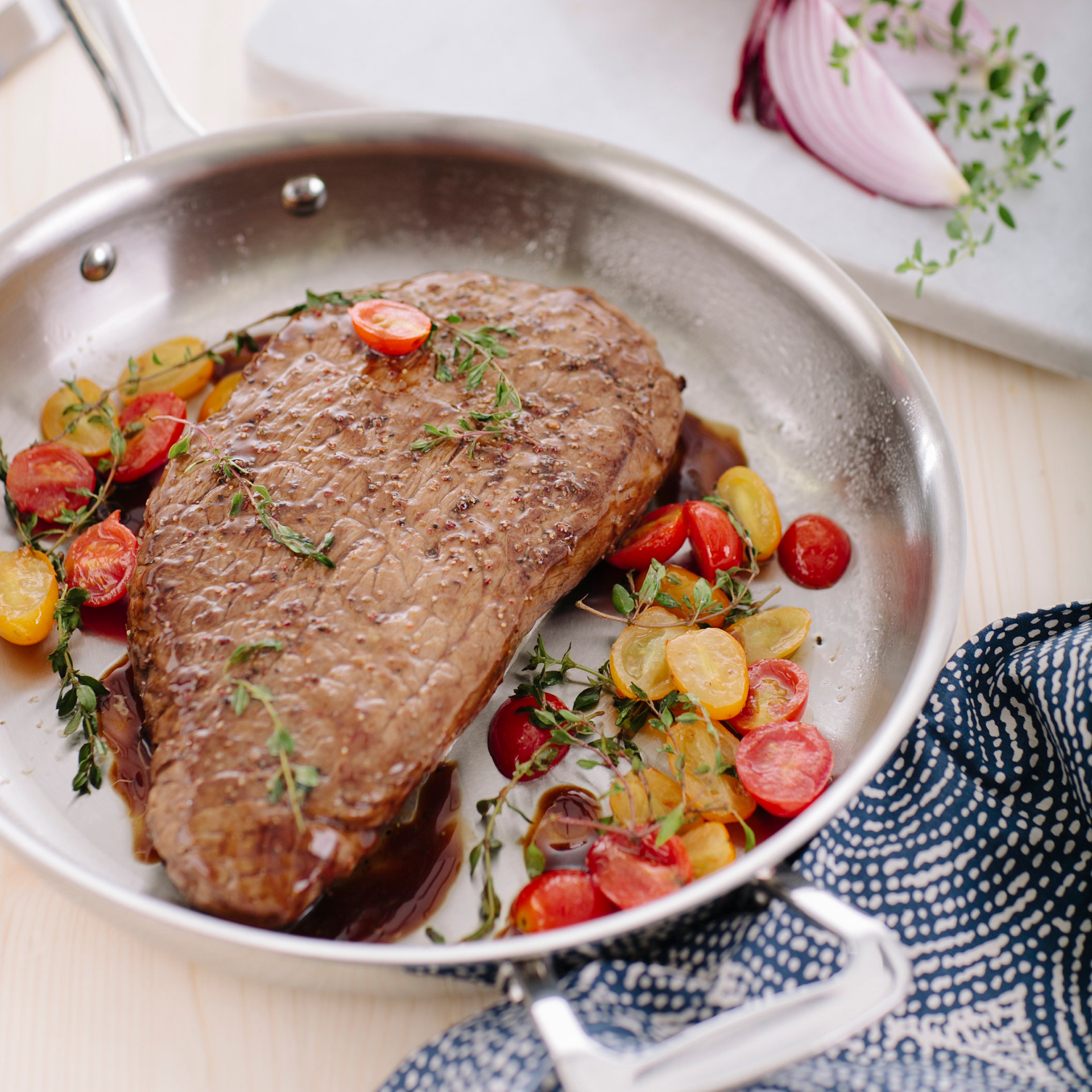 steak cooking in 11.5 inch stainless steel pan
